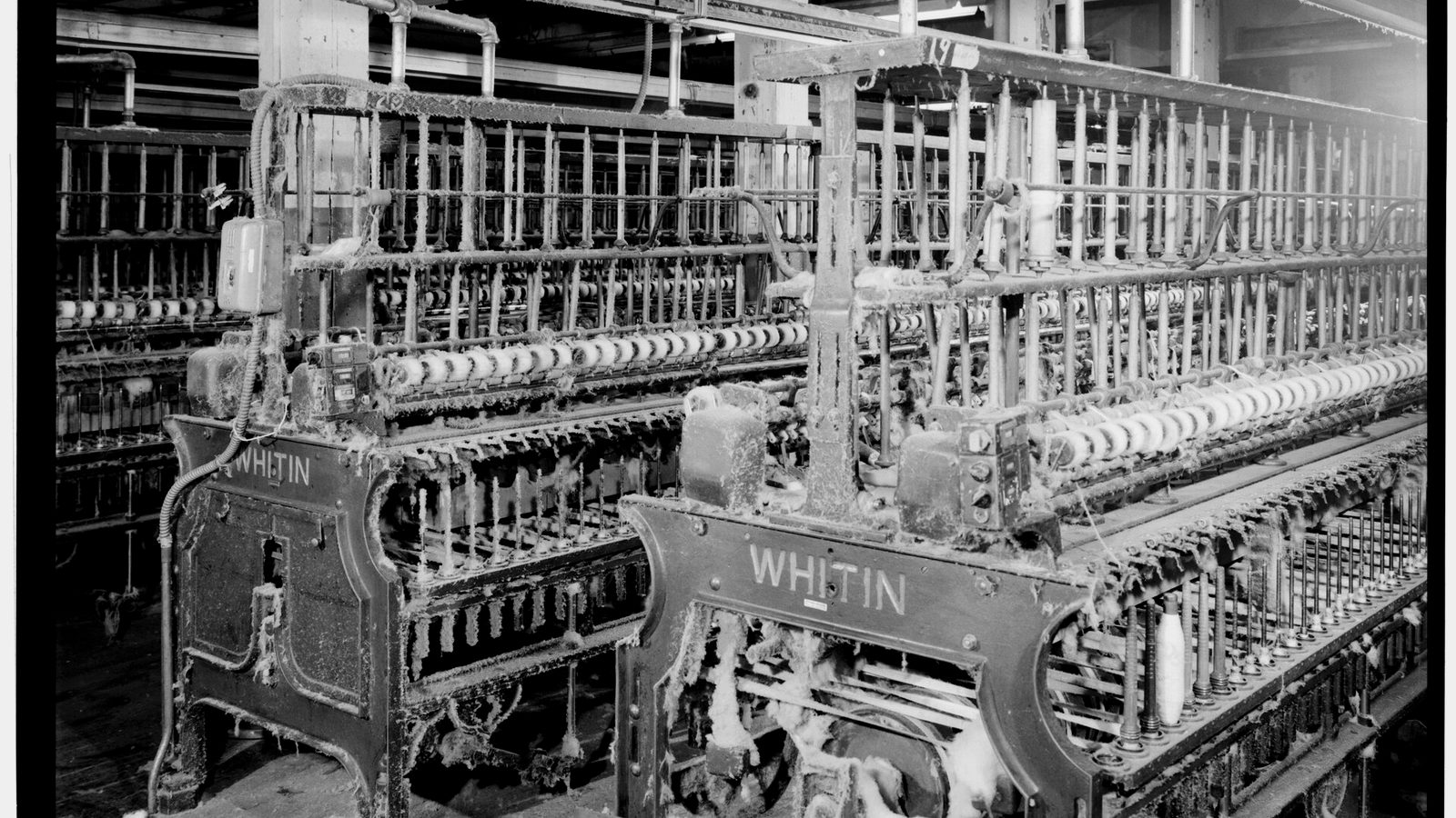 Rows of spinning frames on the third floor of a cotton mill
